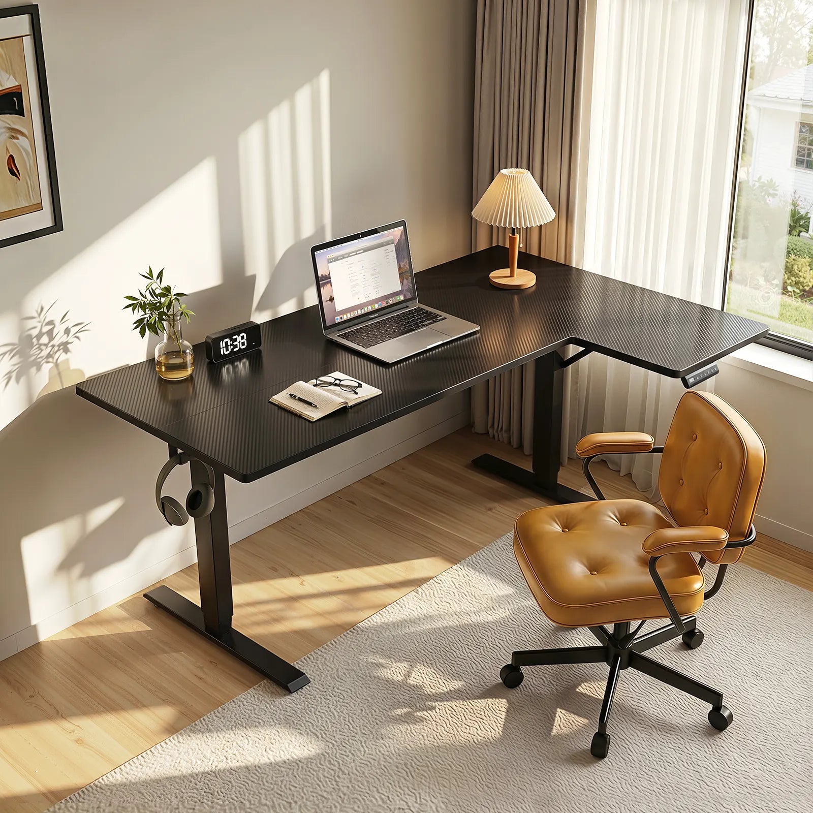 Compact black OffiGo standing desk with minimalist setup, laptop workspace, and warm natural lighting in a modern room.