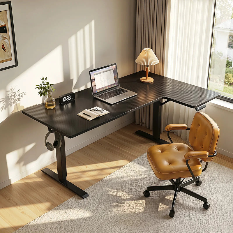 Compact black OffiGo standing desk with minimalist setup, laptop workspace, and warm natural lighting in a modern room.