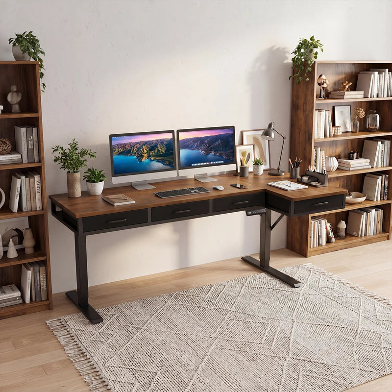 Rustic brown OffiGo L-shaped standing desk with built-in drawers, dual monitors, and organized home office bookshelf setup.