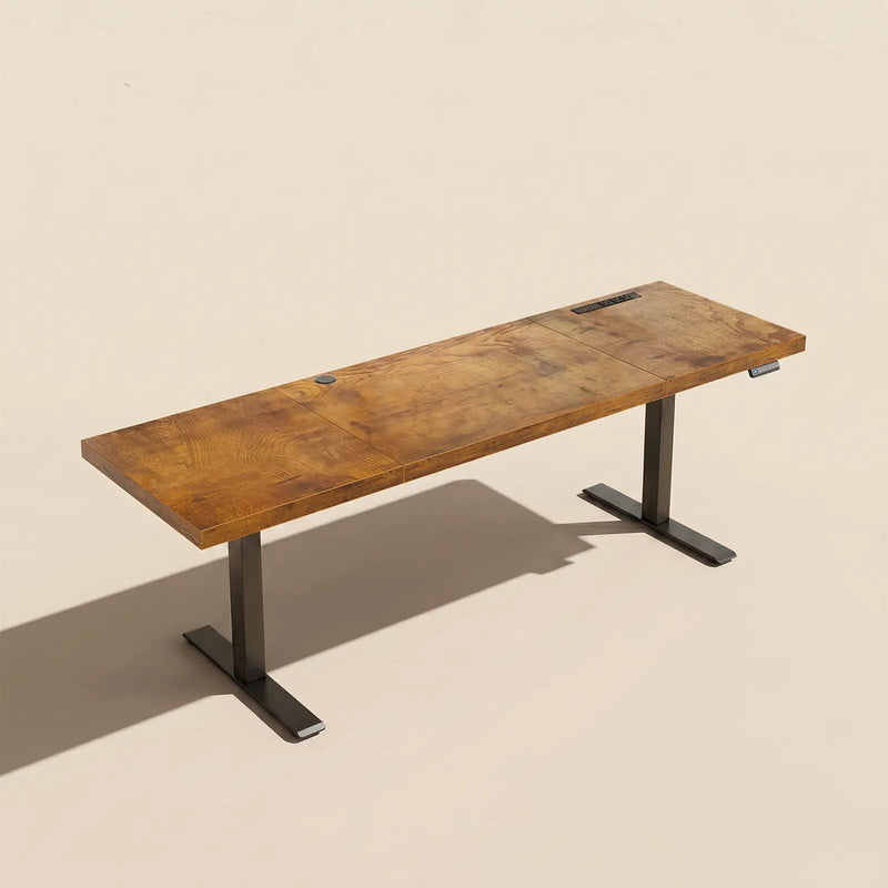 Minimalist OffiGo I-shaped electric standing desk with rustic wooden desktop and black adjustable frame for modern home offices.