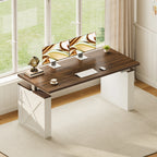 OffiGo 55-inch farmhouse standing desk with a walnut-brown desktop and white X-brace decorative legs, set beside a bright window with dual monitors.