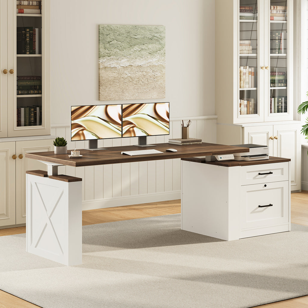 OffiGo 55-inch farmhouse standing desk with a walnut-brown desktop, white X-brace decorative panel and white two-drawer file cabinet, shown in a farmhouse home office with dual monitors beside white bookcases.