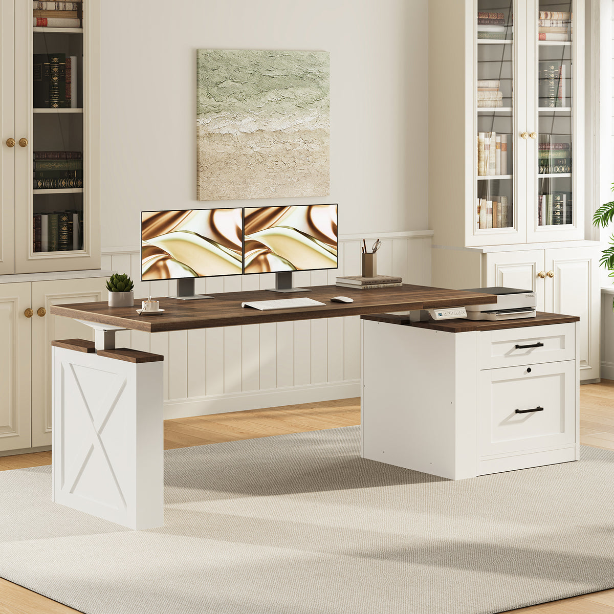 OffiGo 55-inch farmhouse standing desk with a walnut-brown desktop, white X-brace decorative panel and white two-drawer file cabinet, shown in a farmhouse home office with dual monitors beside white bookcases.