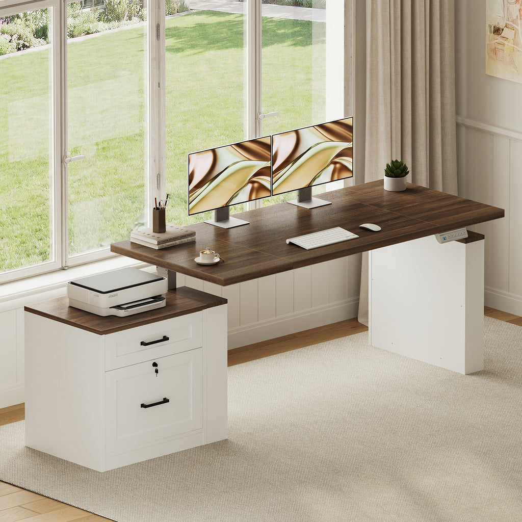 OffiGo 55-inch farmhouse standing desk with a walnut-brown desktop, white X-brace decorative panel and white two-drawer file cabinet, arranged beside a bright window with dual monitors and a printer on the file cabinet.