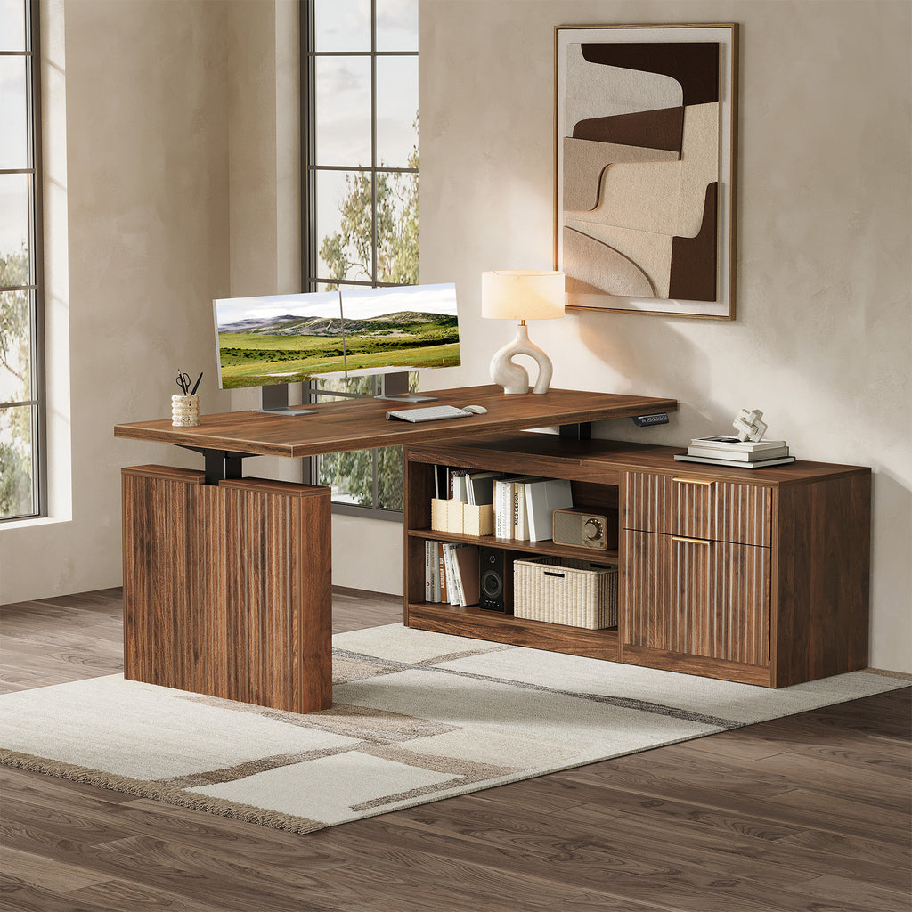 Home office scene showing the OffiGo 55-inch fluted L-shaped standing desk with a walnut-brown desktop and brown legs, with a monitor on the desktop and a matching fluted walnut-brown storage cabinet beneath the return.
