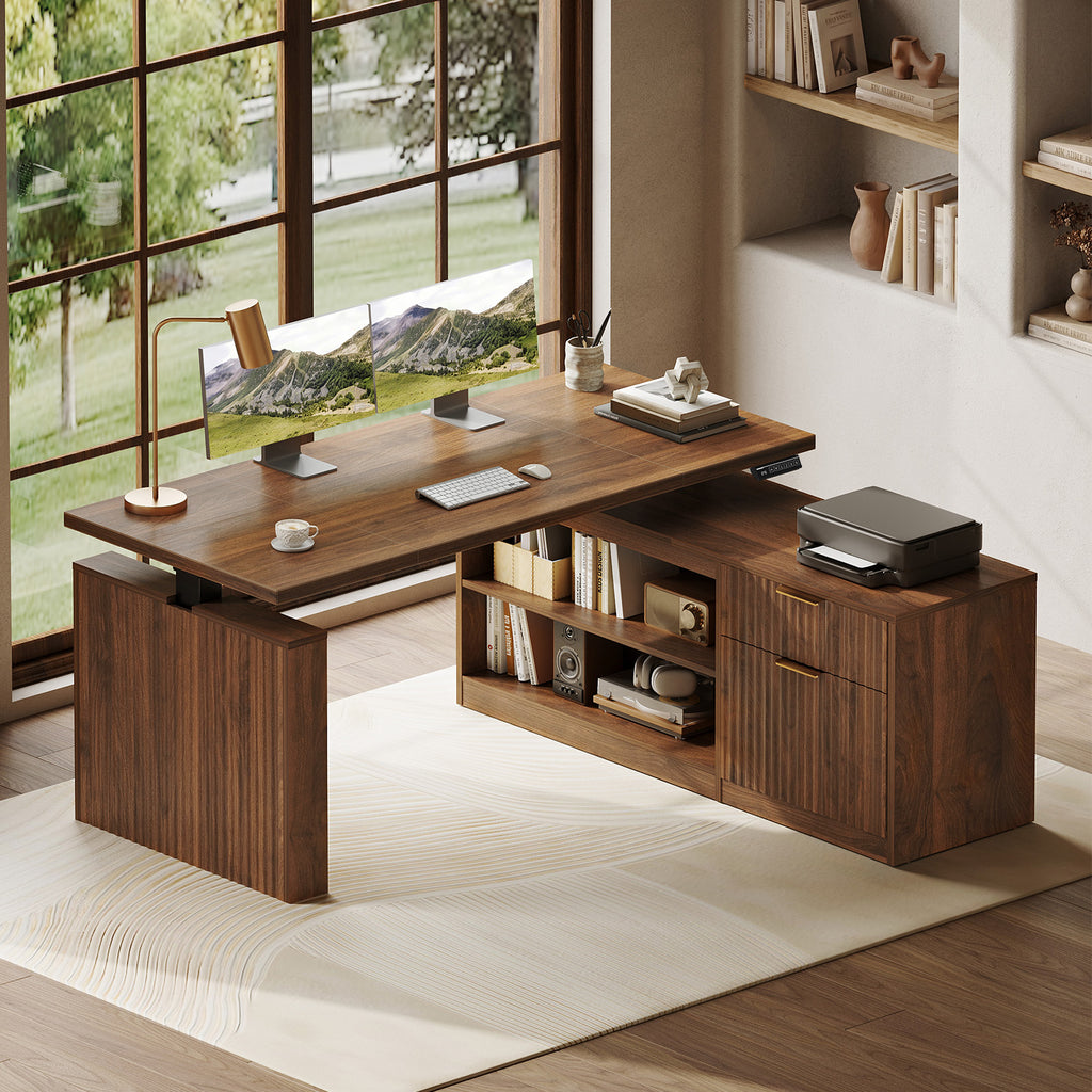 OffiGo 55-inch fluted L-shaped standing desk with a walnut-brown desktop and brown legs, with a matching fluted walnut-brown file cabinet, open shelves and drawers, shown with monitors and a printer.