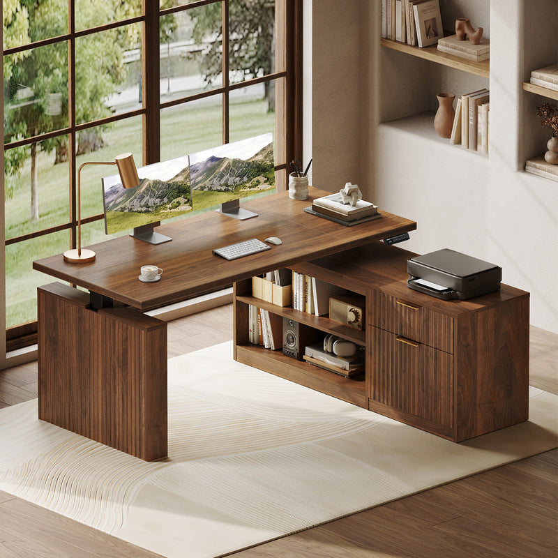 OffiGo 55-inch fluted L-shaped standing desk with a walnut-brown desktop and brown legs, with a matching fluted walnut-brown file cabinet, open shelves and drawers, shown with monitors and a printer.