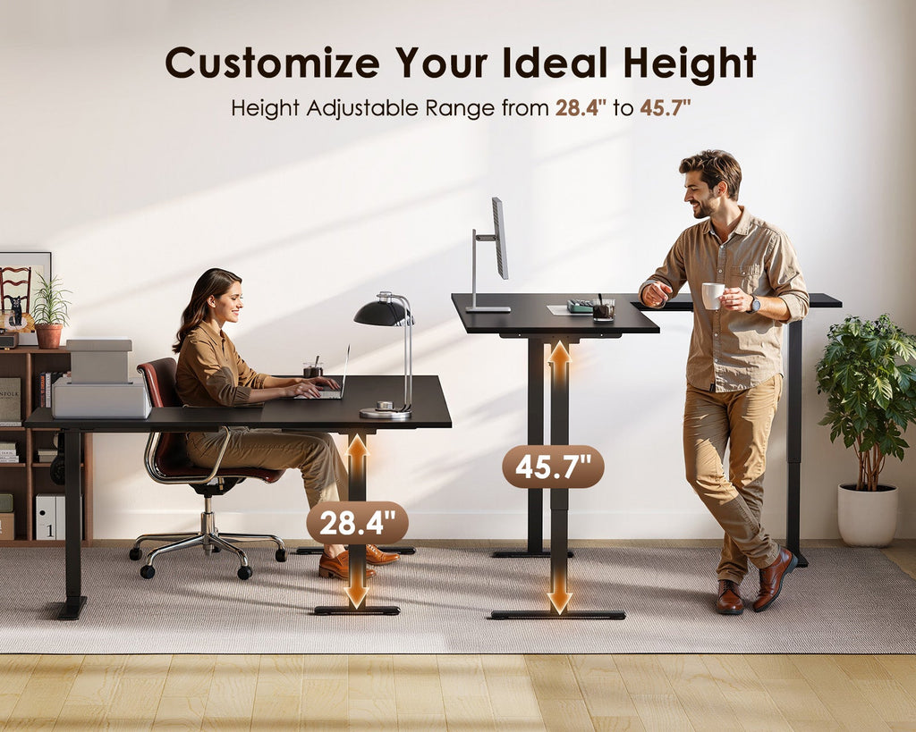 Seated and standing users at the OffiGo black L-shaped electric standing desk, illustrating the 28.4 to 45.7-inch height adjustment range.