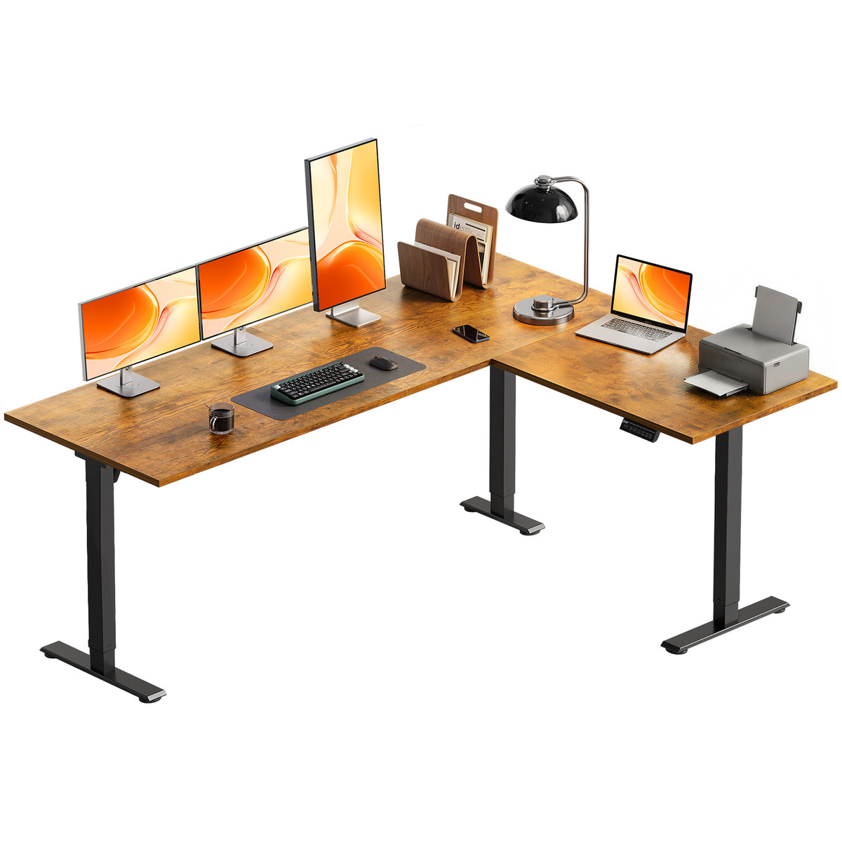 OffiGo 63-inch rustic brown L-shaped electric standing desk with three monitors, a laptop and a printer on its spacious corner desktop.
