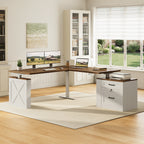 OffiGo 63-inch farmhouse L-shaped standing desk with a walnut-brown desktop, white X-brace side panel and white two-drawer file cabinet, arranged in a farmhouse home office with dual monitors, a laptop and a printer beside white bookcases.