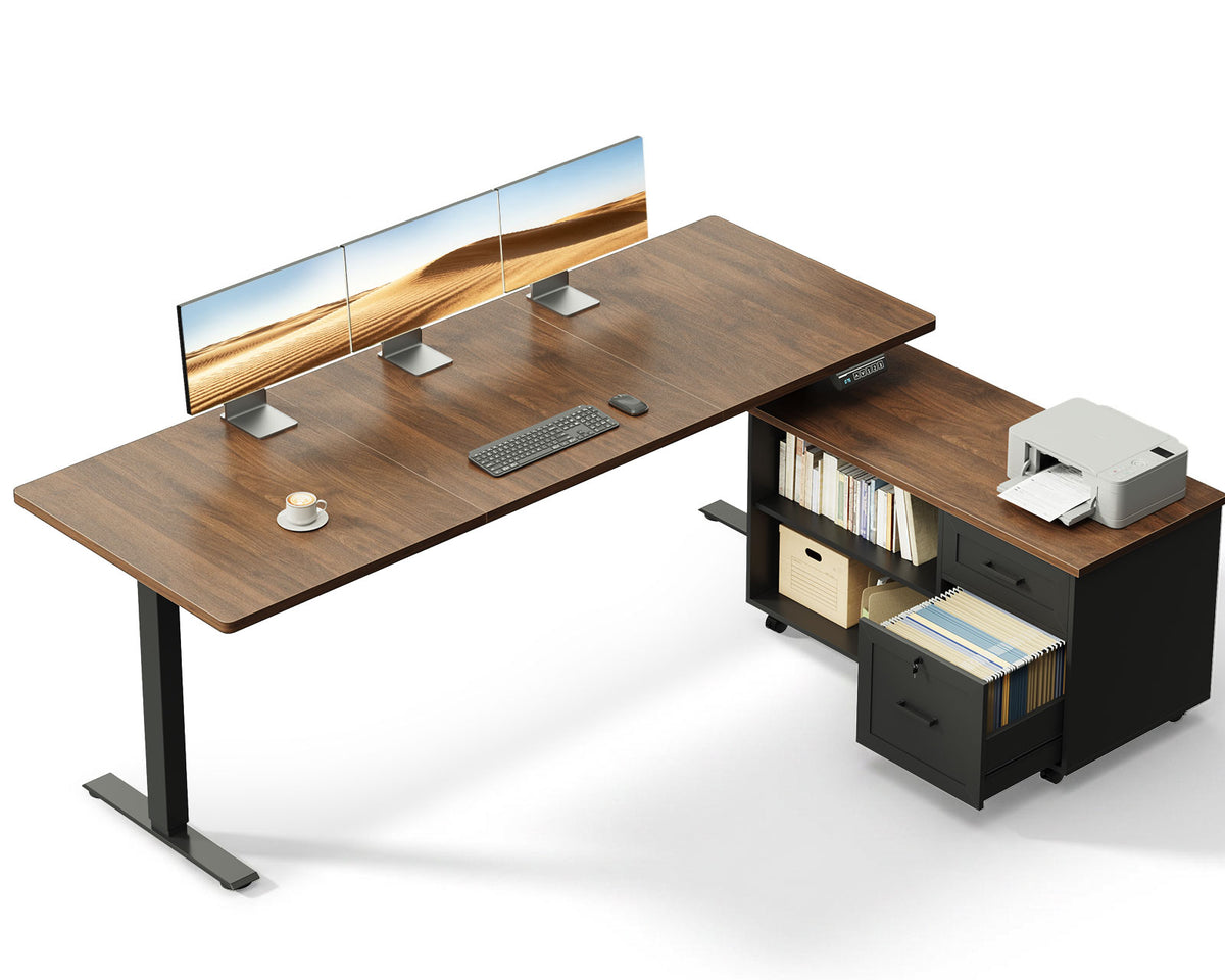 OffiGo 63-inch L-shaped standing desk with a walnut desktop, black legs and a black rolling file cabinet, shown with multiple monitors and a printer on a white background.