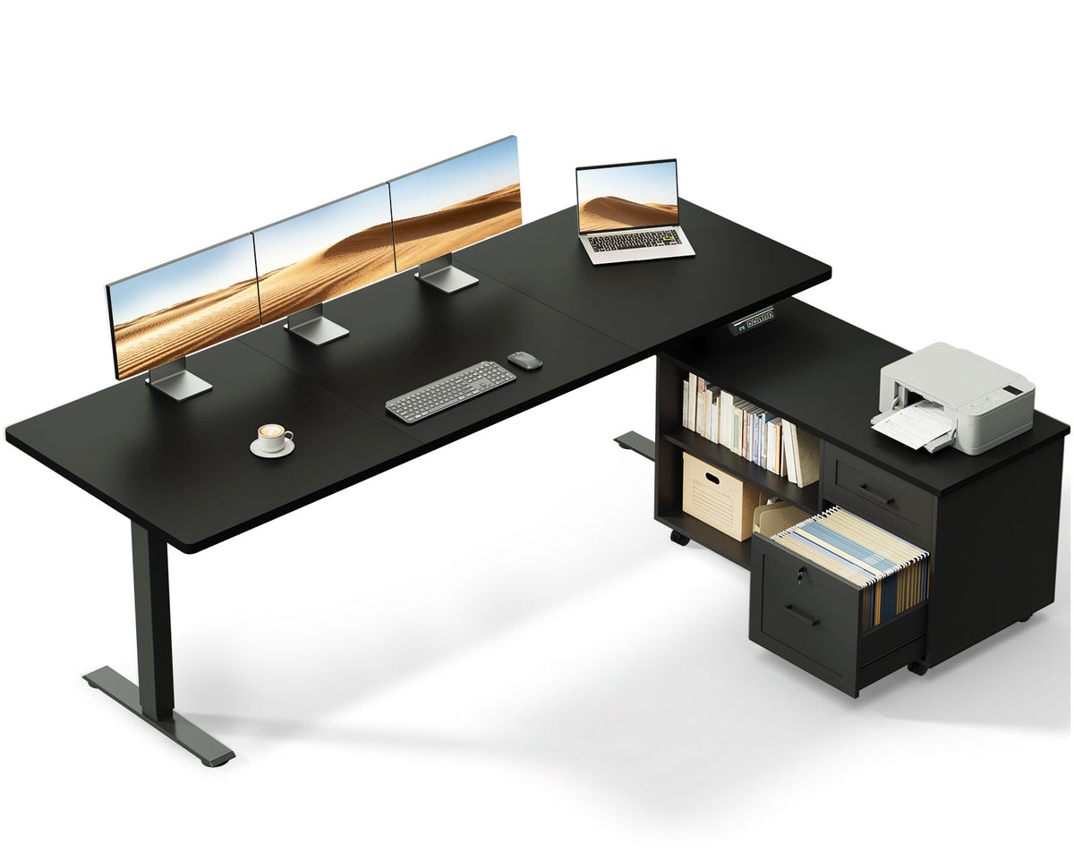 OffiGo 71-inch L-shaped standing desk with a black desktop, black legs and a black rolling file cabinet, shown with multiple monitors and a printer on a white background.