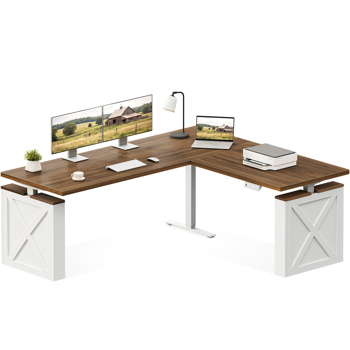OffiGo 71-inch farmhouse L-shaped standing desk with a walnut-brown desktop, white X-brace side panels and a white center support leg, shown on a white background with dual monitors, a laptop and a printer.
