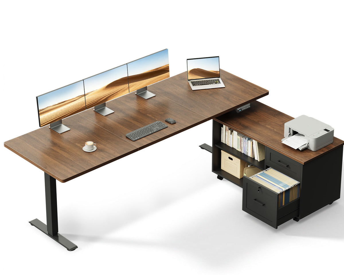 OffiGo 71-inch L-shaped standing desk with a walnut desktop, black legs and a black rolling file cabinet, shown with multiple monitors and a printer on a white background.