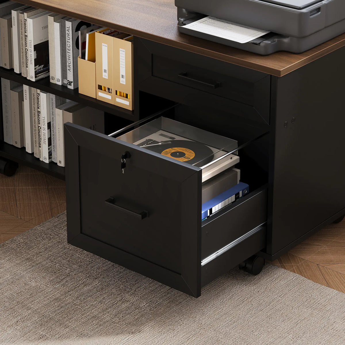 Open lower drawer of an OffiGo rolling storage cabinet holding a record player and binders, with bookshelves and a printer above.