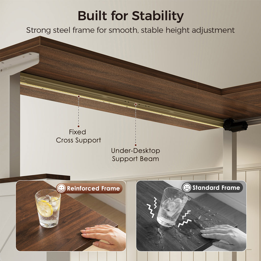 Underside of an OffiGo walnut-brown farmhouse standing desk with a white frame, showing a fixed cross support and under-desktop support beam, with reinforced and standard frame comparisons.